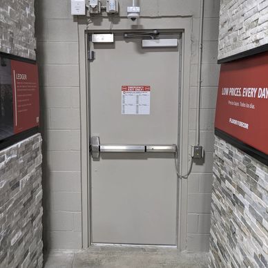 Closed commercial door with panic bar and door closer