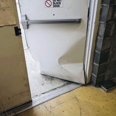 Smashed door illustrating emergency need