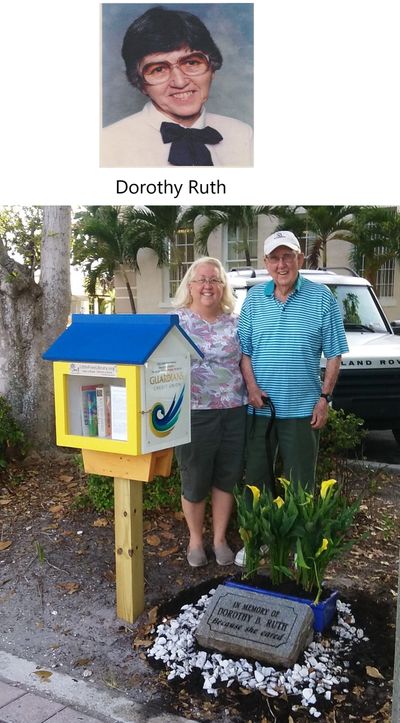 Dorothy's husband Babe, and daughter Cindy at the memorial and Little Free Library that honor her.