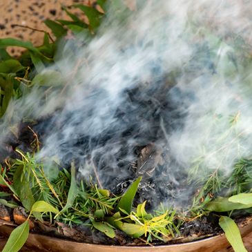 Fire burning traditional leaves smoking