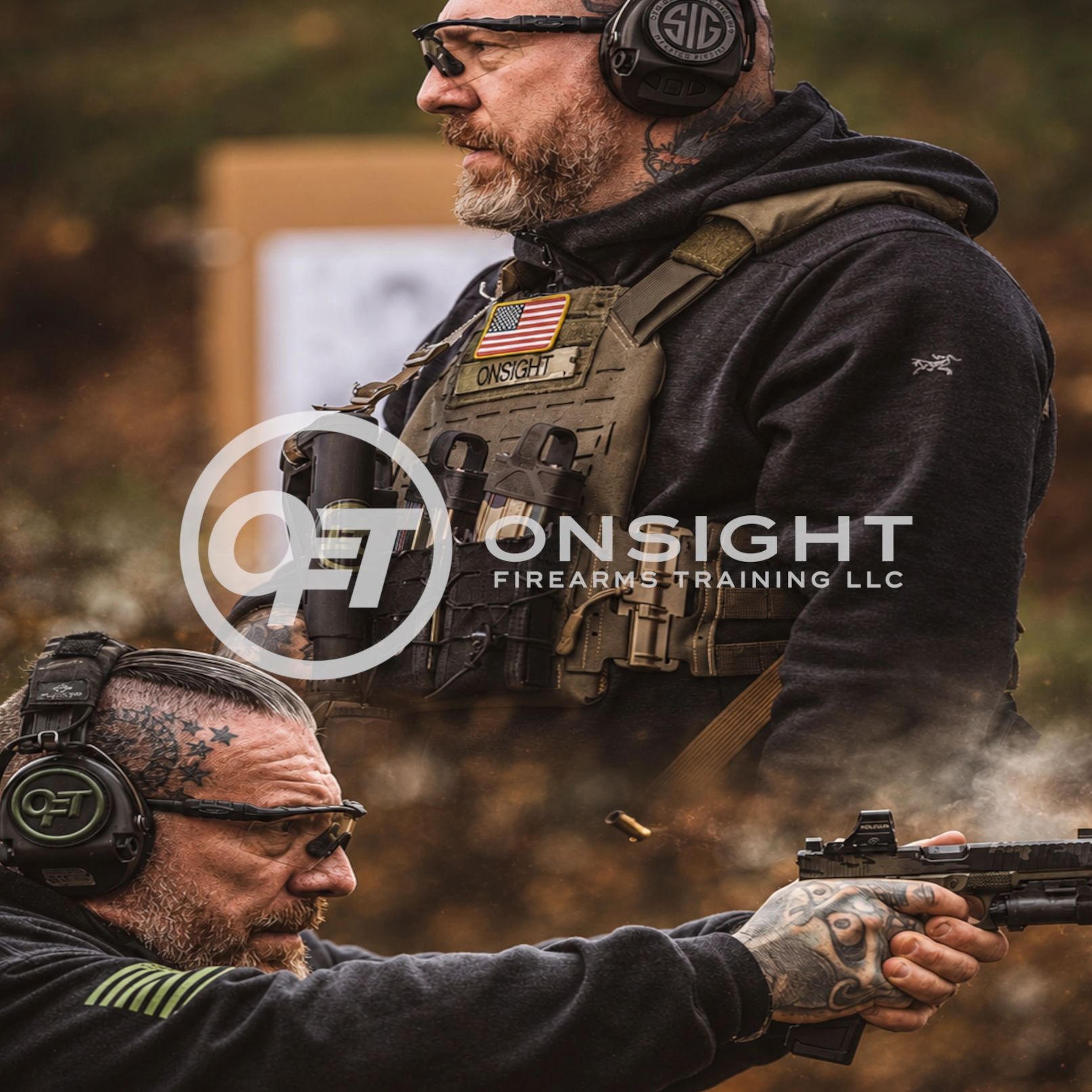 Two men in tactical gear at a firearms training session.