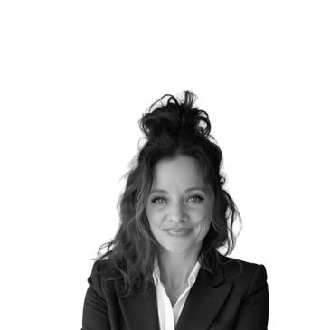 Professional woman in business attire smiling confidently.