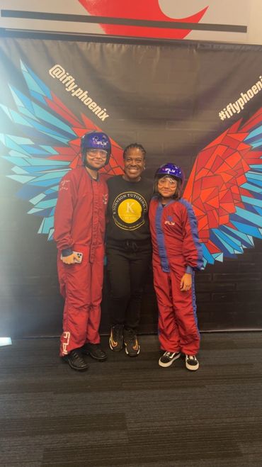 Two students posing with instructor.
