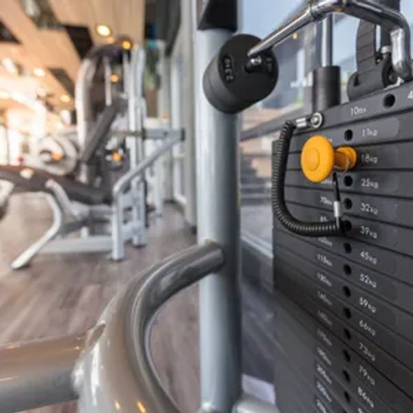 Close-up of a weight stack on gym equipment.