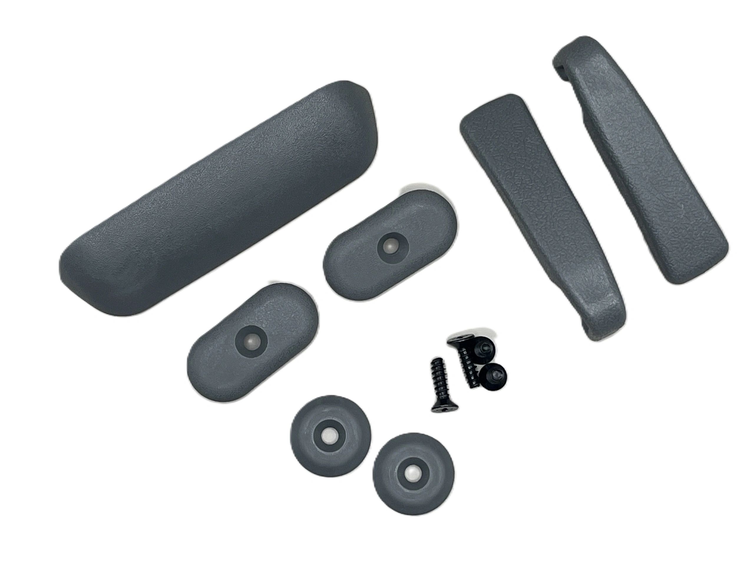 Black plastic furniture or equipment parts with screws.
