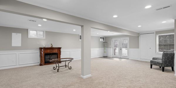 Basement renovation by GPI with new carpet installation and structural improvements in a residential property in Virginia