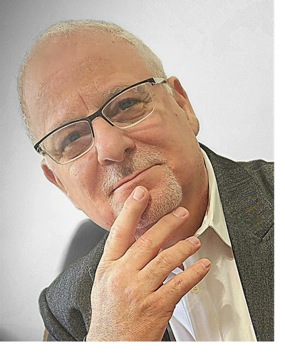 Thoughtful older man with glasses and gray hair.