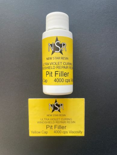 Bottle and box of New Star Resin Pit Filler for windshield repair.