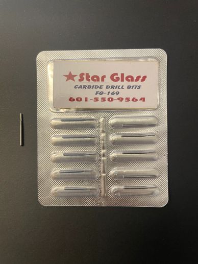 Star Glass carbide drill bits in blister pack with one bit outside.