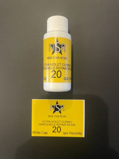 Bottle and box of New Star Resin UV curing windshield repair resin.