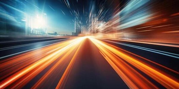 Bright streaks of light create a dynamic sense of speed on a futuristic highway.