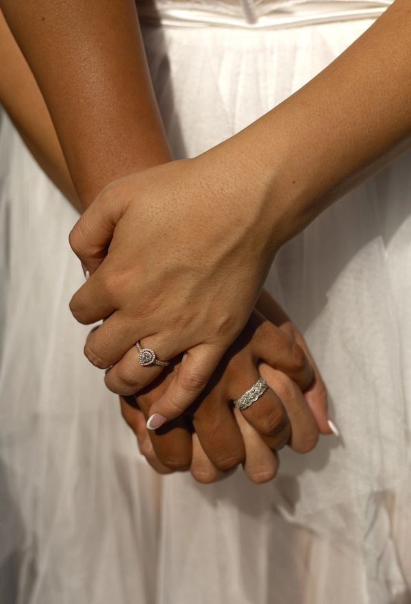 An engaged couple holding hands at sunset in Sacramento, California. Romantic engagement photography