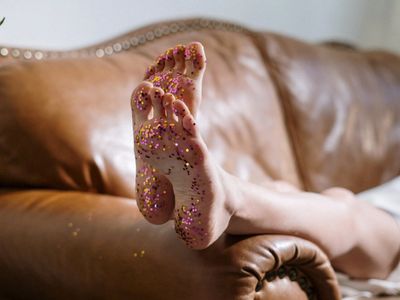 A pair of feet covered in glitter