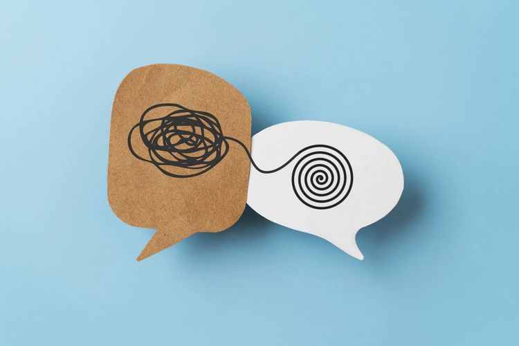 Two speech bubbles showing tangled and untangled lines symbolizing communication.