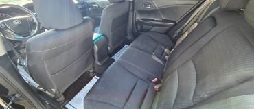 Interior rear view of a car with black seats.