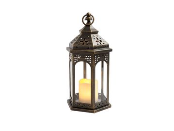 Ornate metal lantern with candle inside.