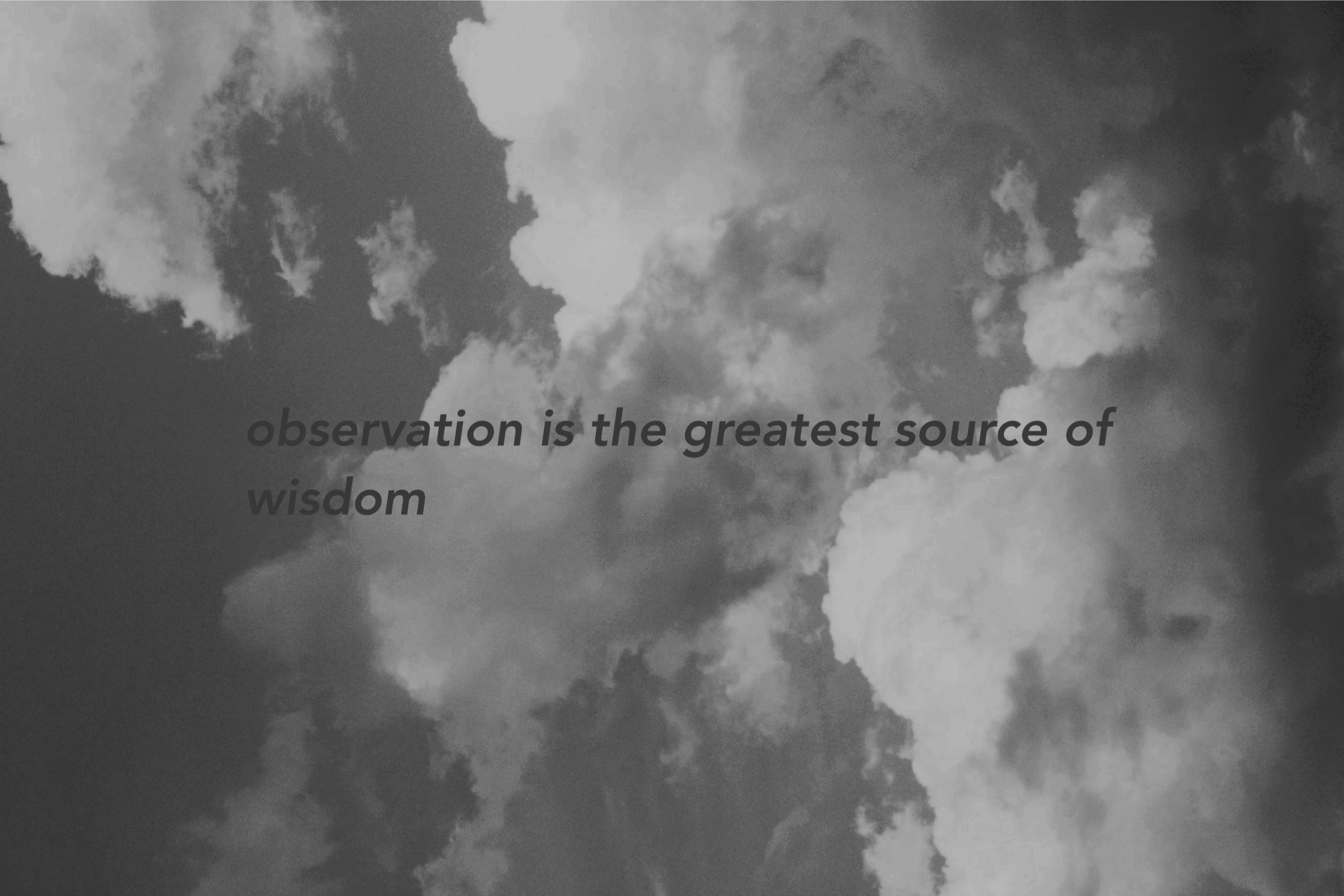 A black and white image of clouds with a quote in the middle.–
