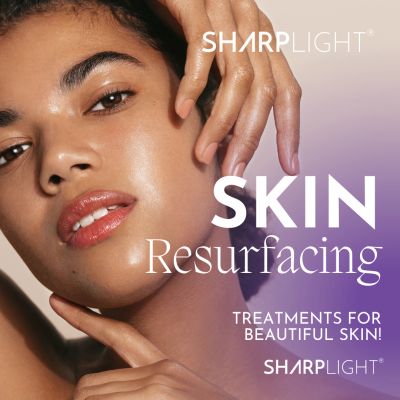 Close-up of a woman showing glowing skin promoting skin resurfacing treatments.