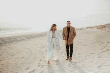 Newlywed couple enjoying each other on a beautiful beach.