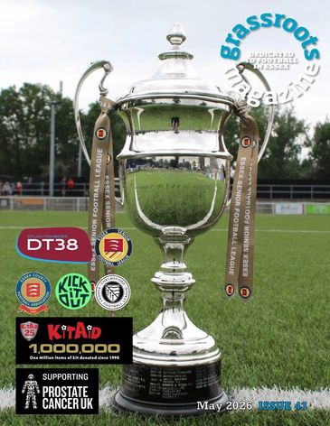 Silver football trophy on grass pitch, May 2026 issue cover of Grassroots magazine.