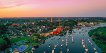 Overview of The Quomps and Christchurch Priory taken at dawn over the River Stour. ©MpressEveVisuals