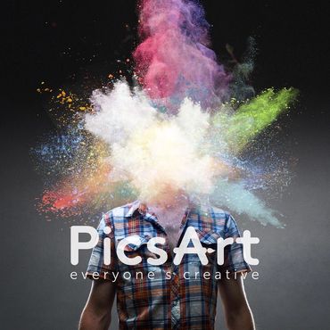 Person with colorful powder explosion obscuring their head against a dark background.