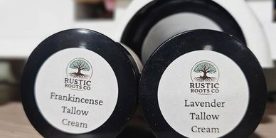 Two jars of Rustic Roots Co tallow creams, frankincense and lavender scents.