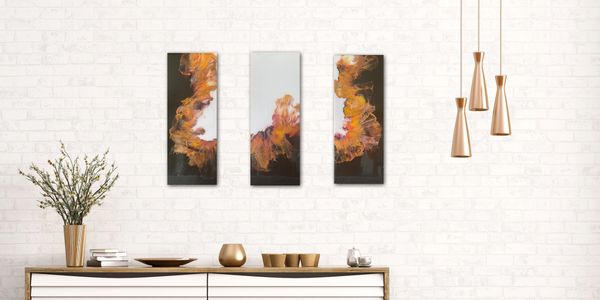 Fluid art paintings displayed in a contemporary home.