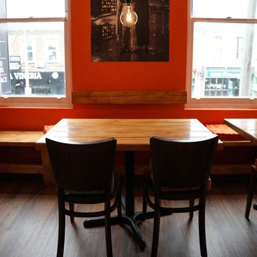 Freshly painted walls, refreshed windows, handcrafted tabled and bench with back rest