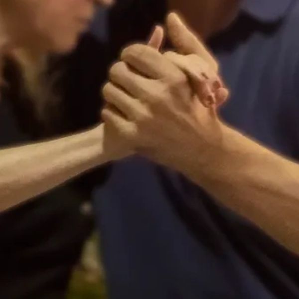 two hands in a tango embrace 