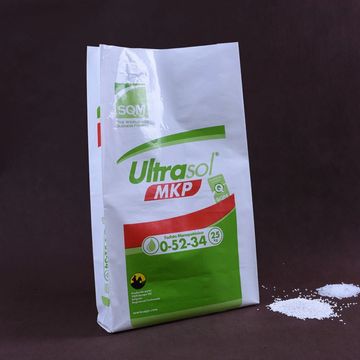 Bag of Ultrasol MKP fertilizer with some spilled granules.