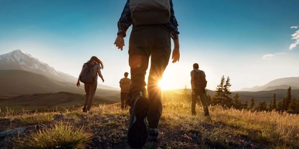 people hiking in the mountians early morning.
