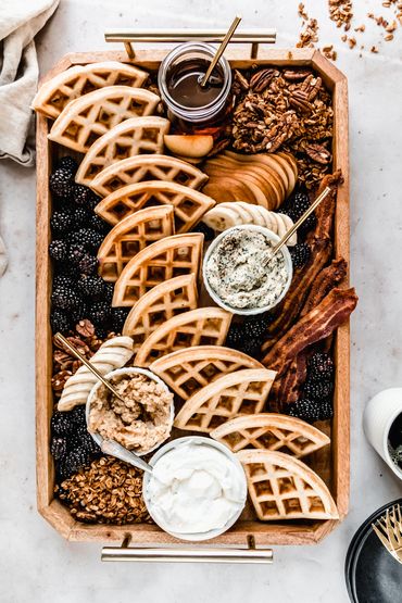 waffle breakfast board with blackberries, bacon, granola and sliced fruit made by Chicago Food Styli
