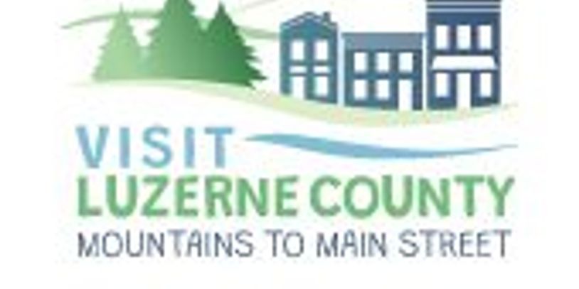 Logo promoting tourism in Luzerne County, featuring mountains and buildings.