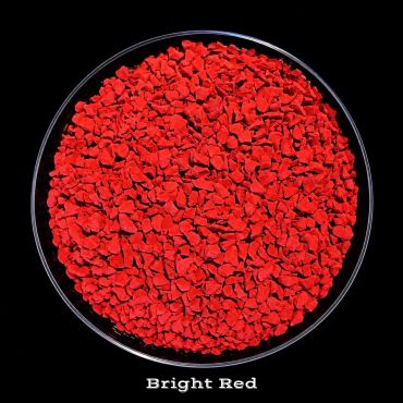 Bright red granular material in a round container.