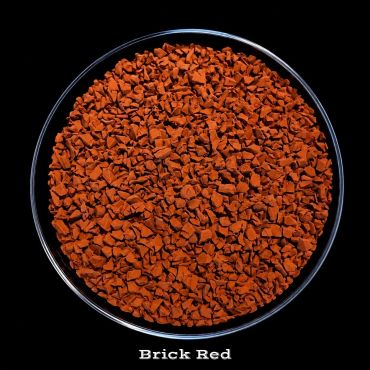 Brick red granules in a circular container.