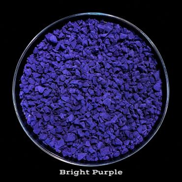 Bright purple granules in a clear dish.