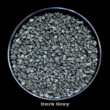 Dark grey gravel or crushed stone in a round container.