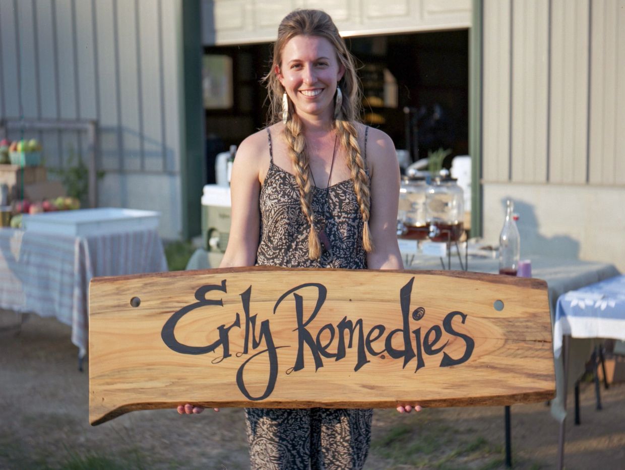 Liz holding Erly Remedies sign