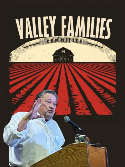 A man speaks at a podium with a Valley Families Committee backdrop.