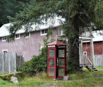 Red and black telephone booth in Hyder, Alaska