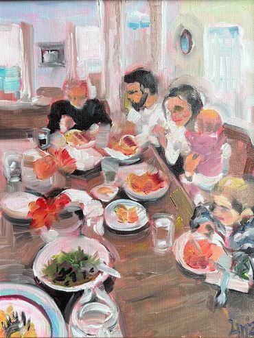 a feast set out on a dining table with a father, a son, a daughter, a baby, and a toddler eating