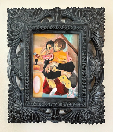 A mom holding a girl toddler tight