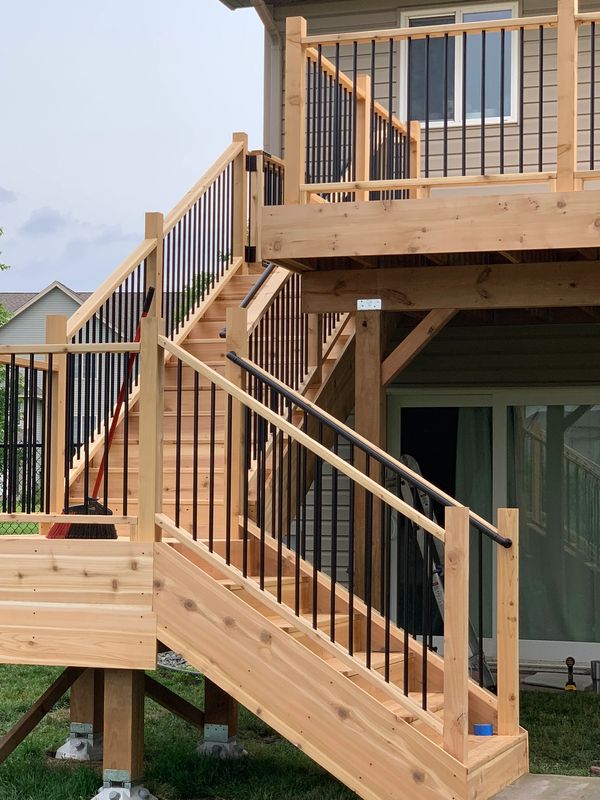 wood deck, black banisters.