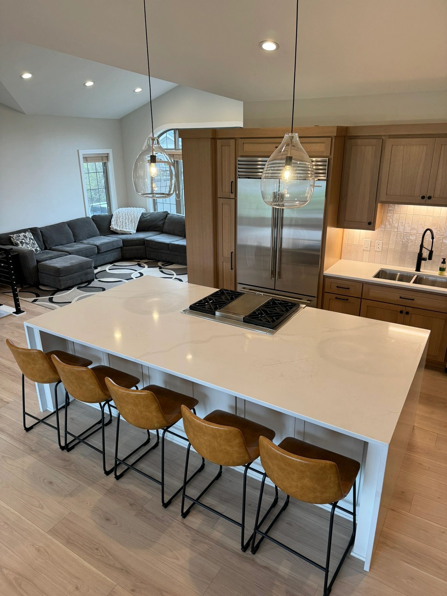 Expert-renovated kitchen In St. Michael, MN with a beautiful oversized white marbled island. 