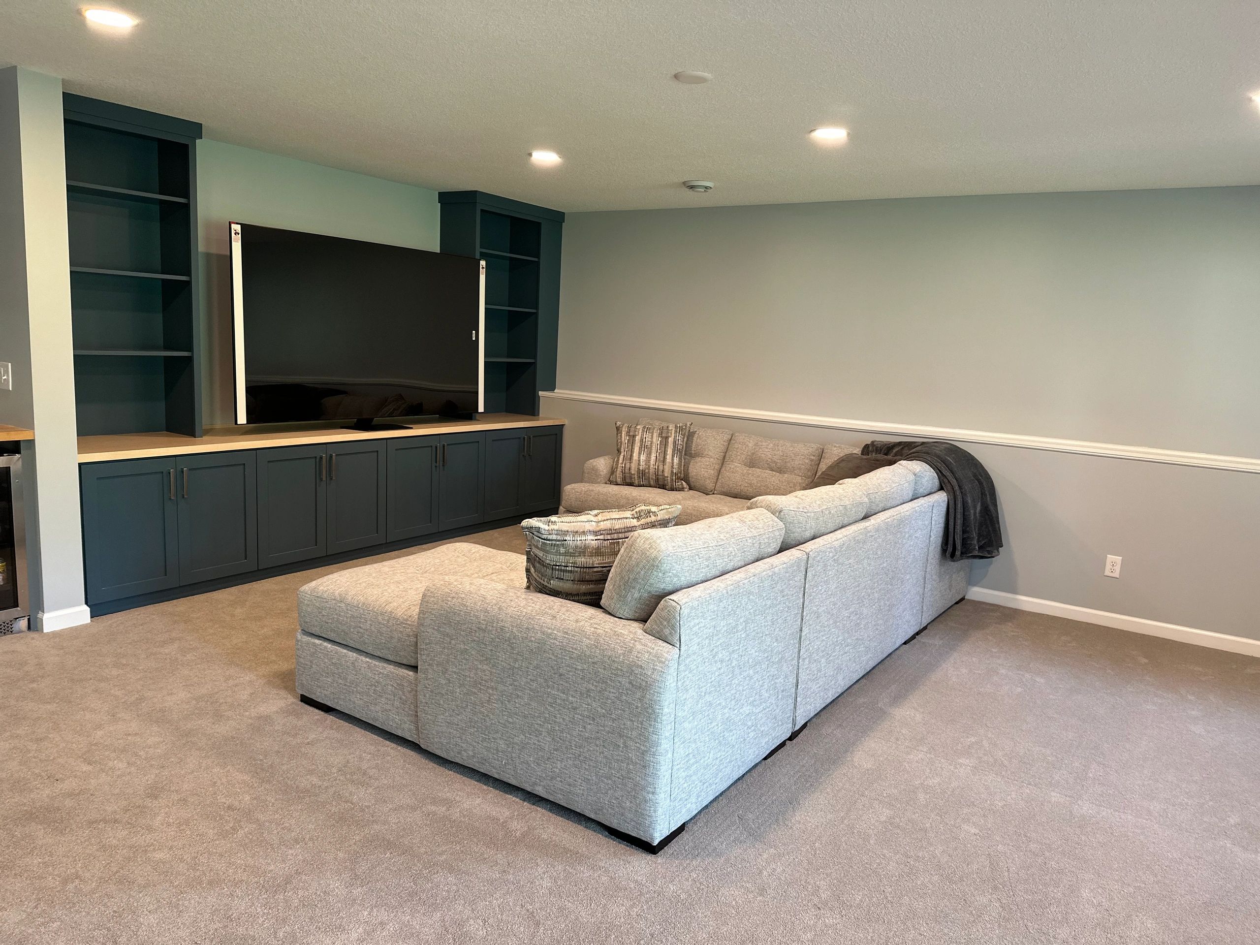 Cozy Basement Renovation in Ramsey, MN done by Get It Rite Construction. Custom Built Entertainment.