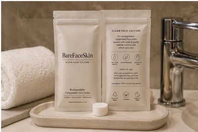 BareFaceSkin biodegradable compressed face cloths displayed on a bathroom tray with towel and faucet.