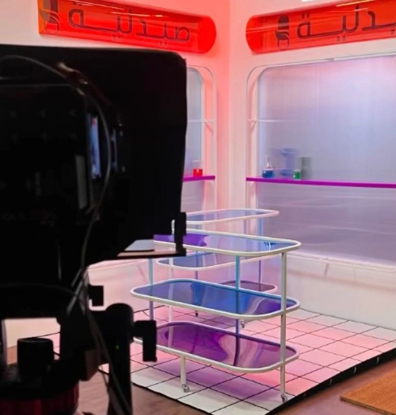 Colorful studio setup with a camera and neon lights.