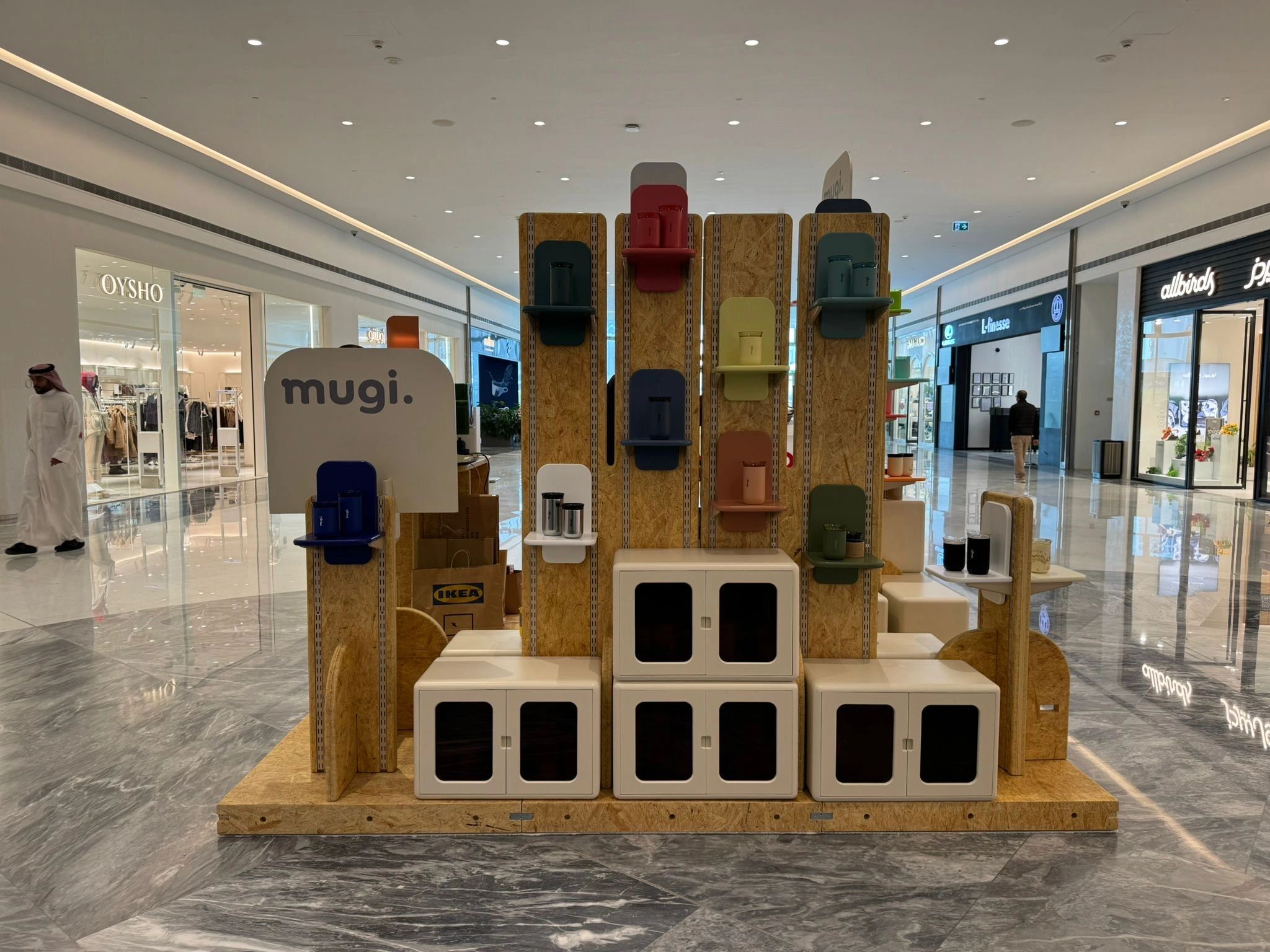 A modern display of colorful storage boxes in a shopping mall.