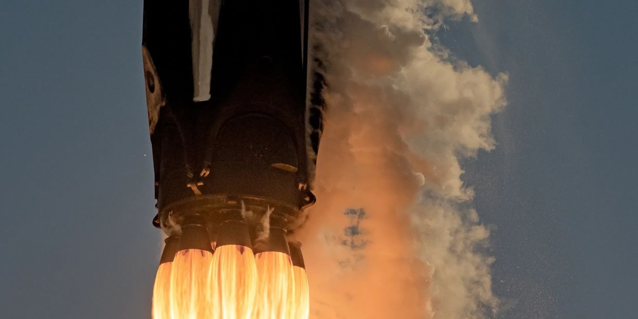 Rocket blasting off, close up of thrusters.